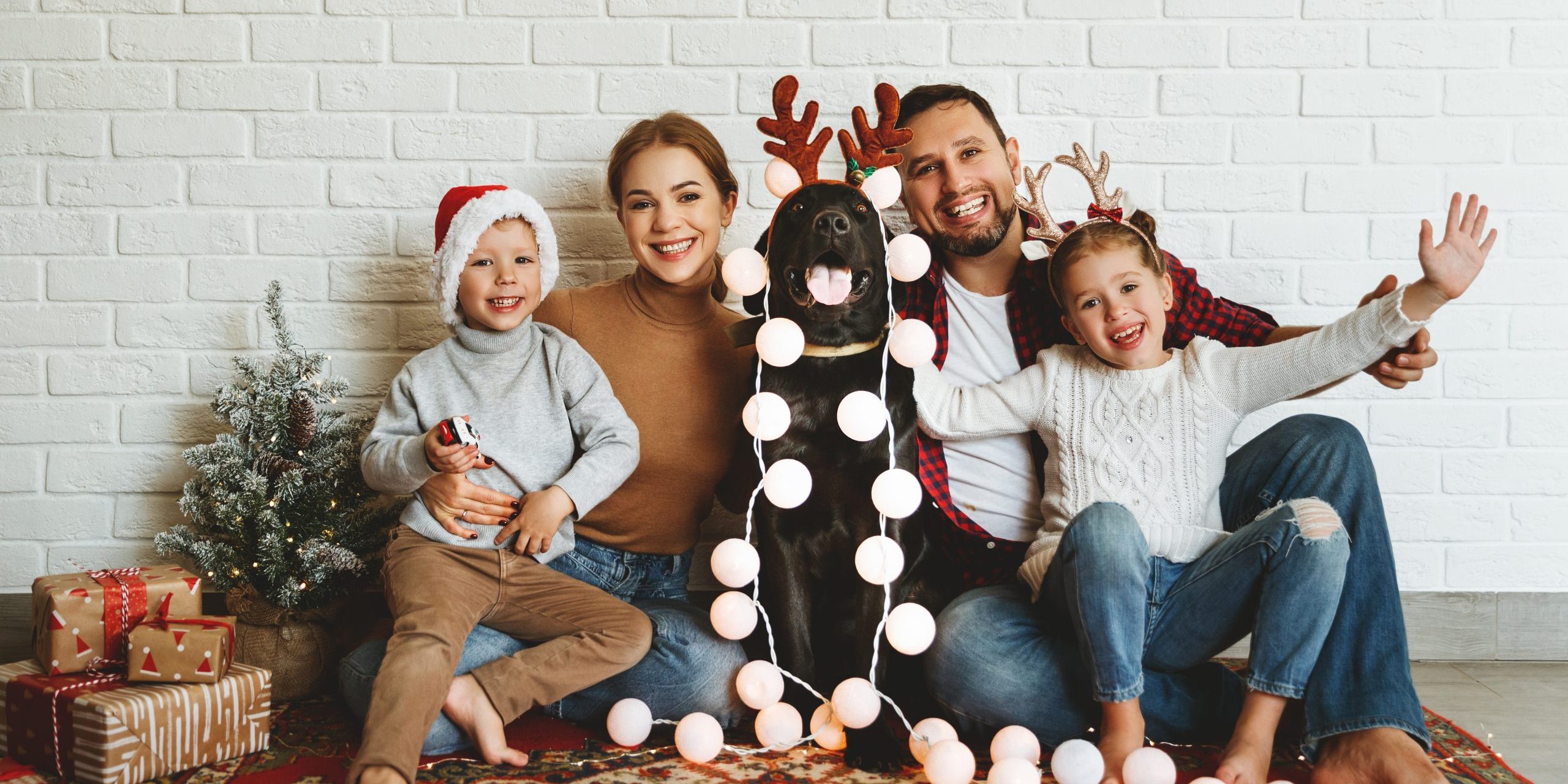 Happy,Christmas!,Family,Mother,Father,And,Kids,With,Dog,Before